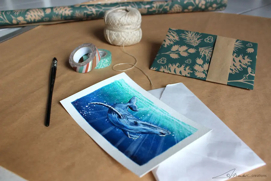 Photo illustrant la préparation pour l'envoi d'une commande de dessin avec une peinture de baleine à bosse